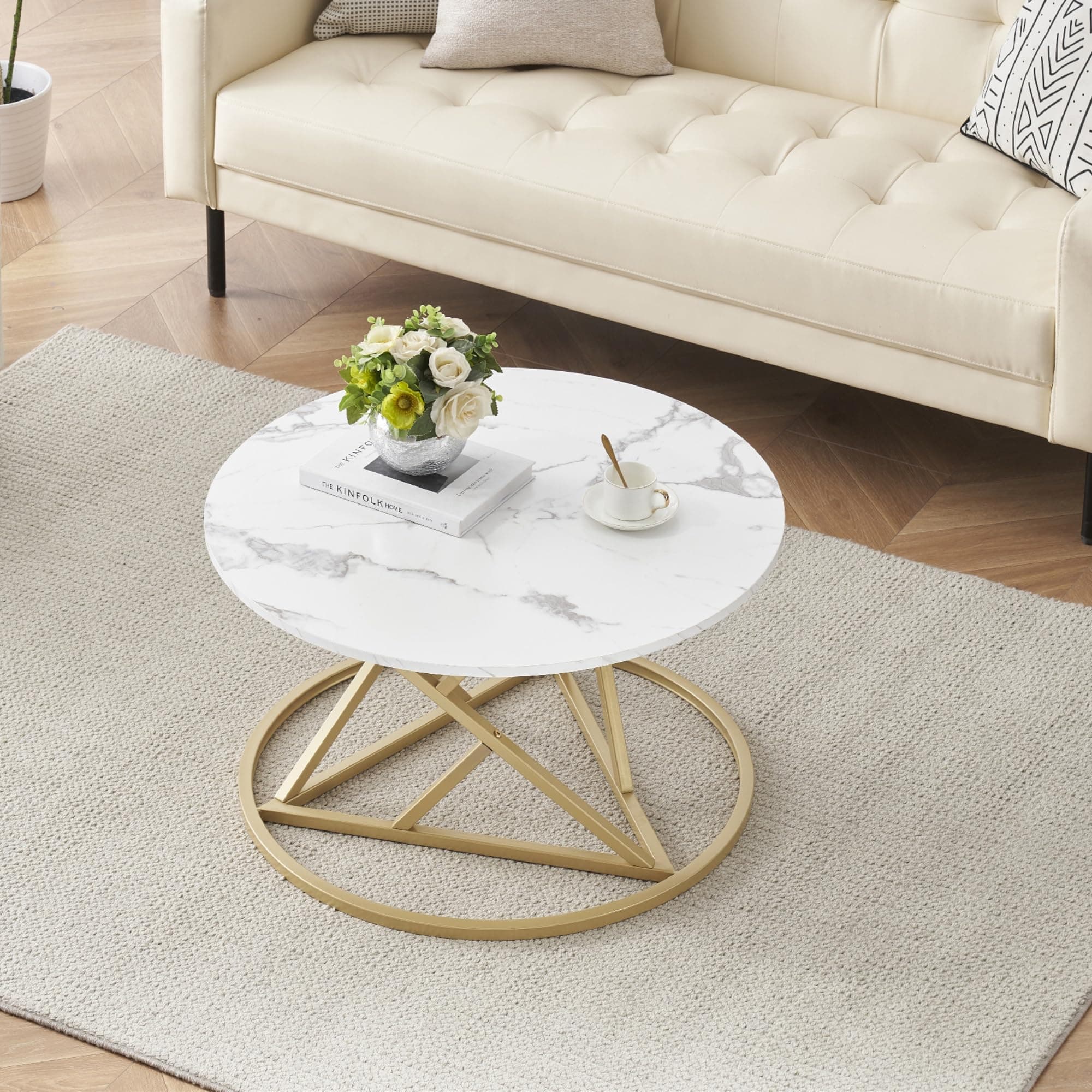 Mesa de centro redonda con tapa de mármol blanco y base dorada