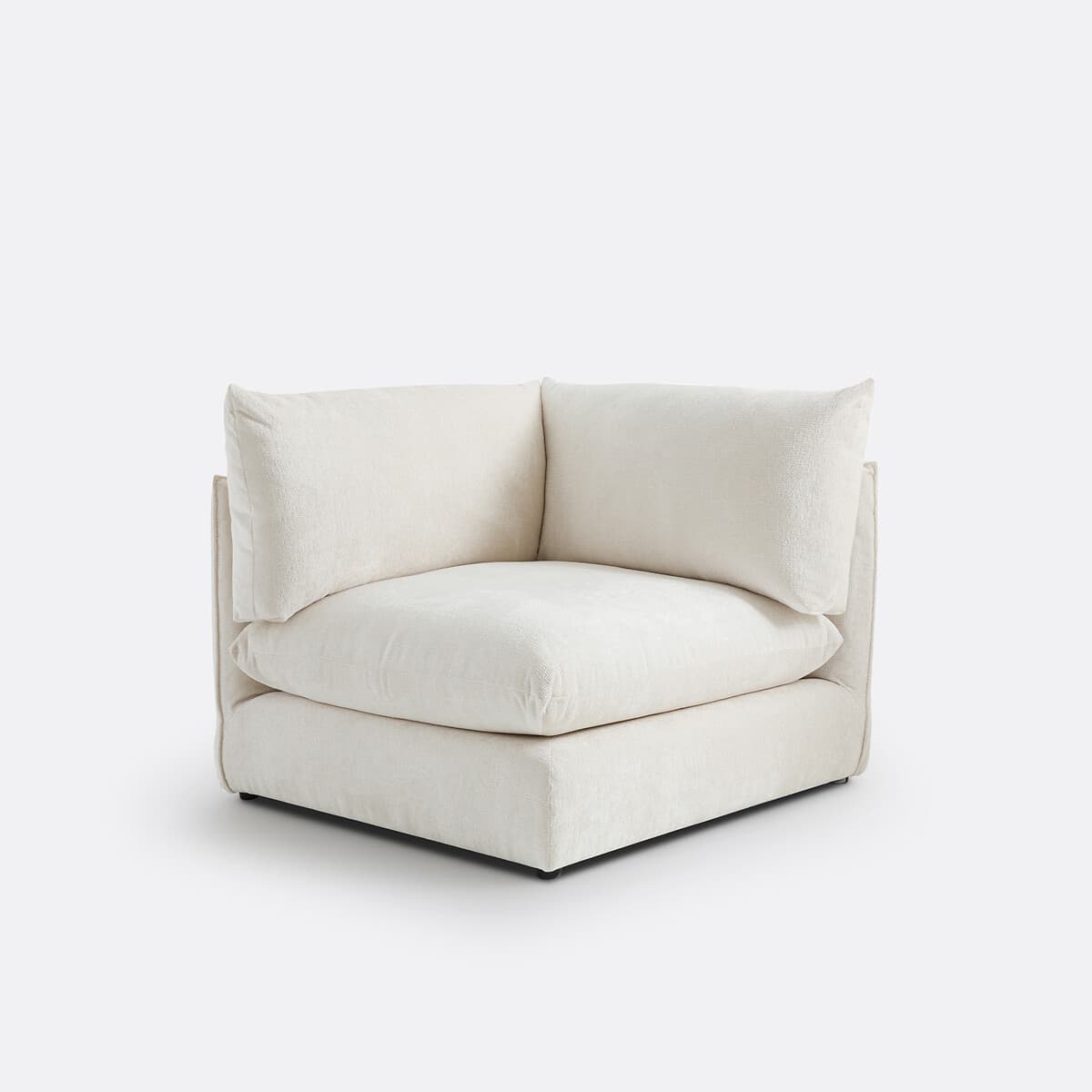 Módulo esquinero de sofá modular en tejido bouclé color crema