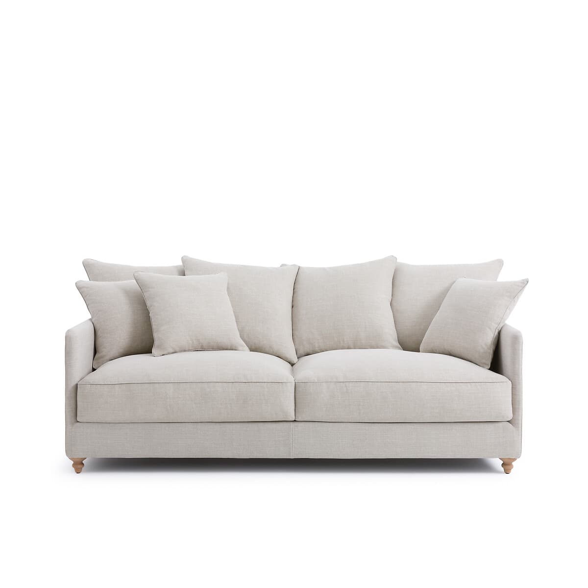 Sofá de lino beige con cojines