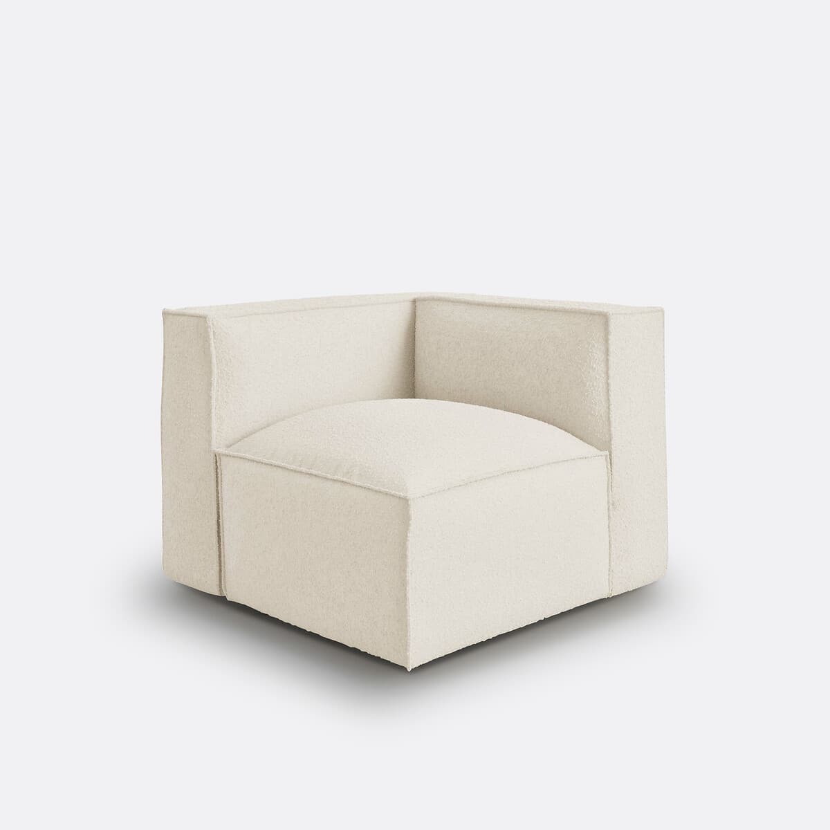 Sillón modular tapizado en bouclé crema