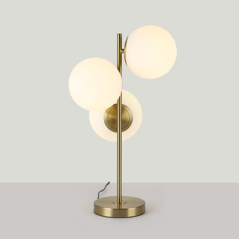 Lámpara de mesa dorada con esferas de cristal blanco